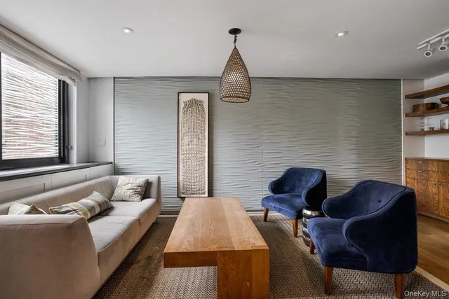 a bedroom with furniture and a fireplace