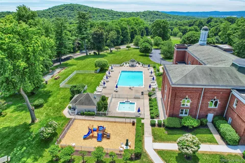 an aerial view of a house with yard