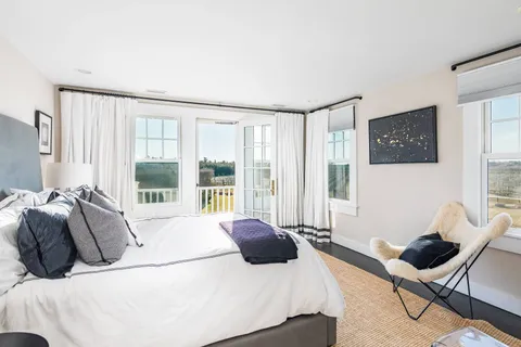 a balcony with furniture and city view