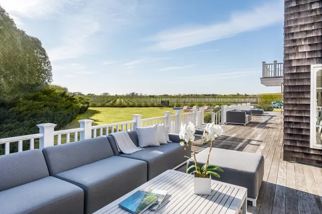 a view of a patio with couches chairs and a table