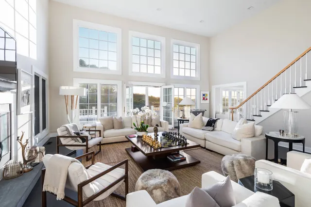 a kitchen with stainless steel appliances kitchen island granite countertop a stove and a large window