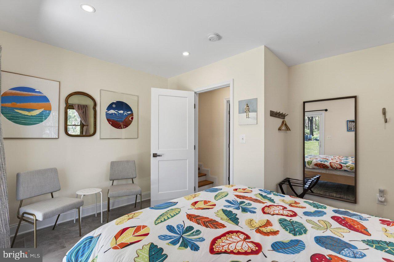 202 Lake Arrowhead Road Luray, VA 22835 - Photo 17 of 47 a bedroom that has a bed and a chair in it
