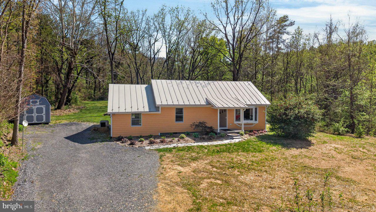 202 Lake Arrowhead Road Luray, VA 22835 - Photo 31 of 47 a backyard of a house with table and chairs