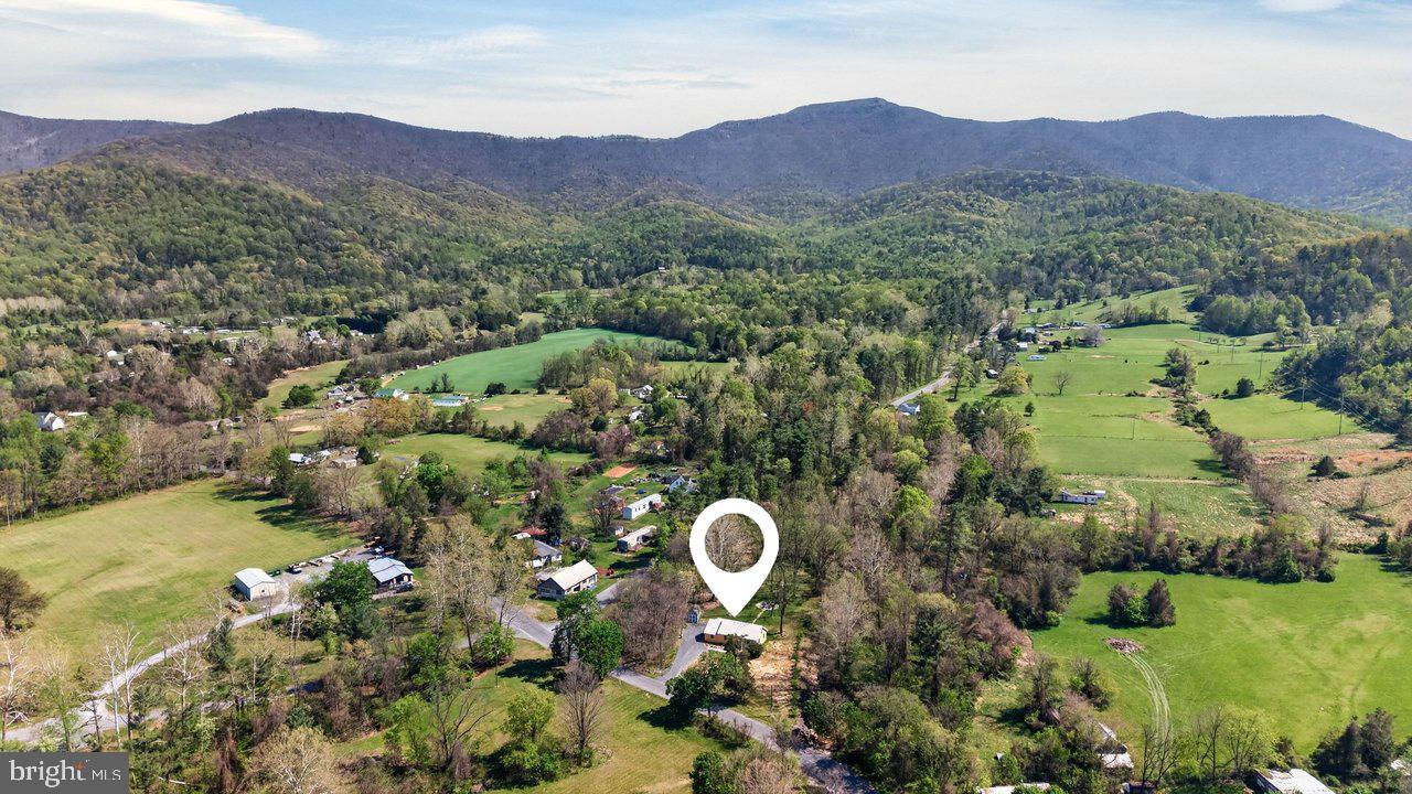 202 Lake Arrowhead Road Luray, VA 22835 - Photo 41 of 47 a view of a lush green hillside and a houses