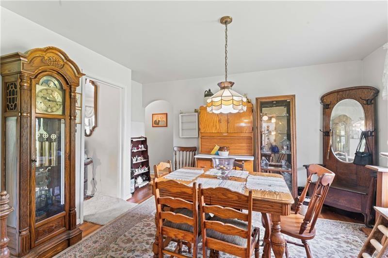 2102 Darlington Road Beaver Falls, PA 15010 - Photo 15 of 41 a dining room with furniture a chandelier and wooden floor