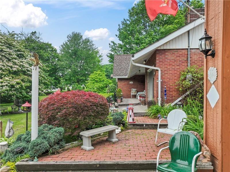 2102 Darlington Road Beaver Falls, PA 15010 - Photo 3 of 41 a view of a backyard with plants and a patio