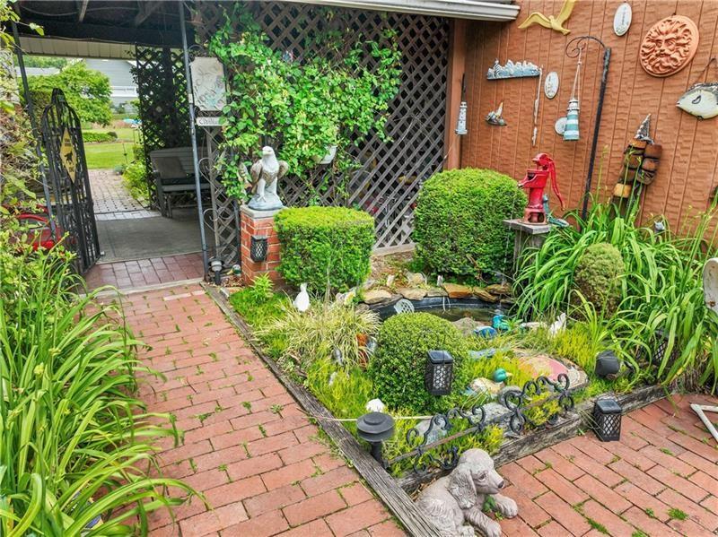 2102 Darlington Road Beaver Falls, PA 15010 - Photo 5 of 41 a view of a garden with flowers