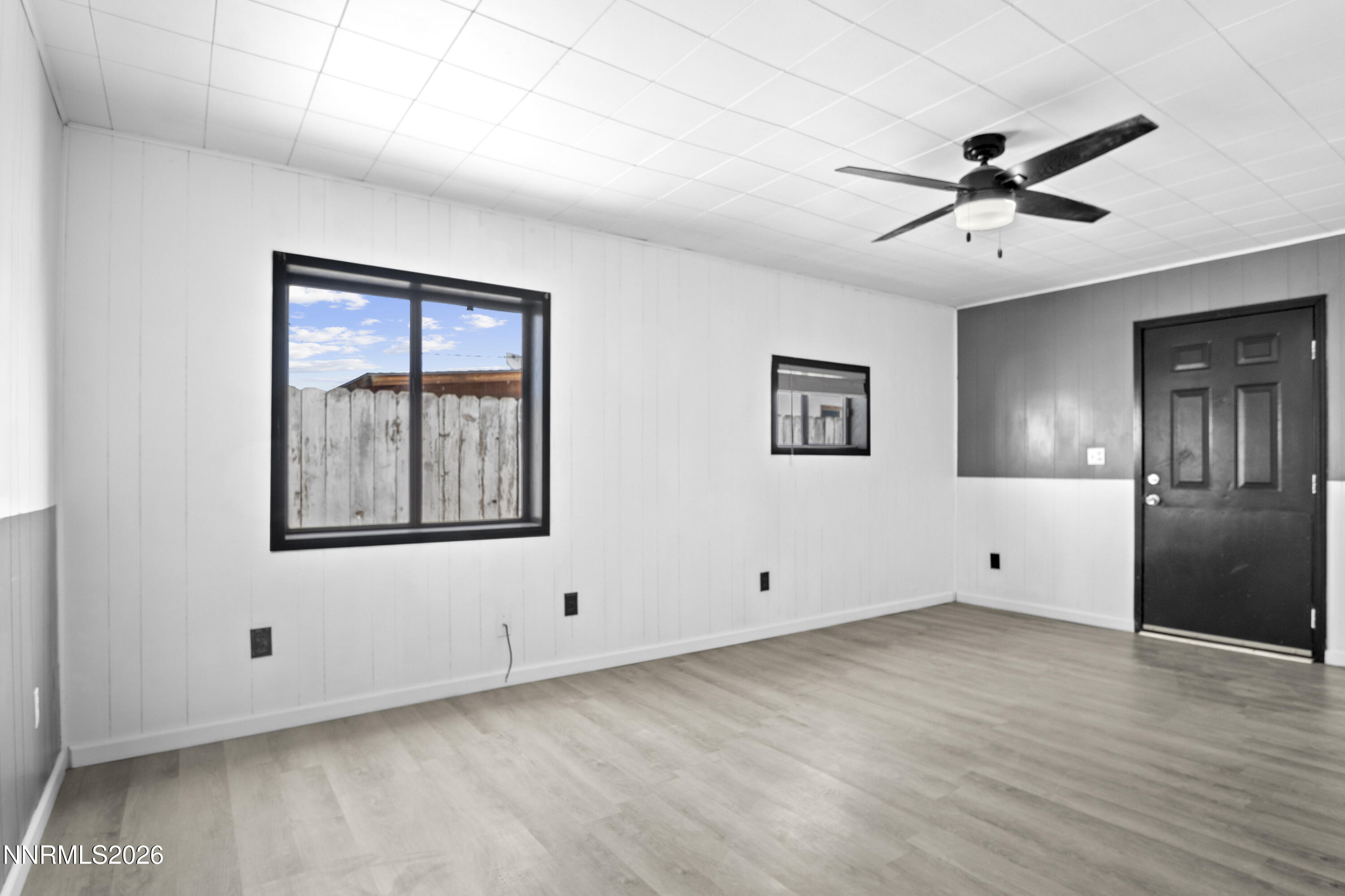 885 I Street Hawthorne, NV 89415 - Photo 6 of 20 a view of an empty room with window and wooden floor