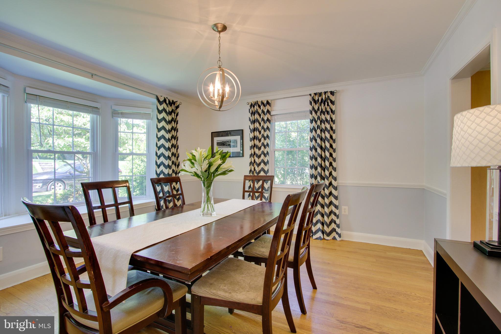 607 Worcester Road Baltimore, MD 21286 - Photo 14 of 42 a view of a dining room with furniture window and wooden floor