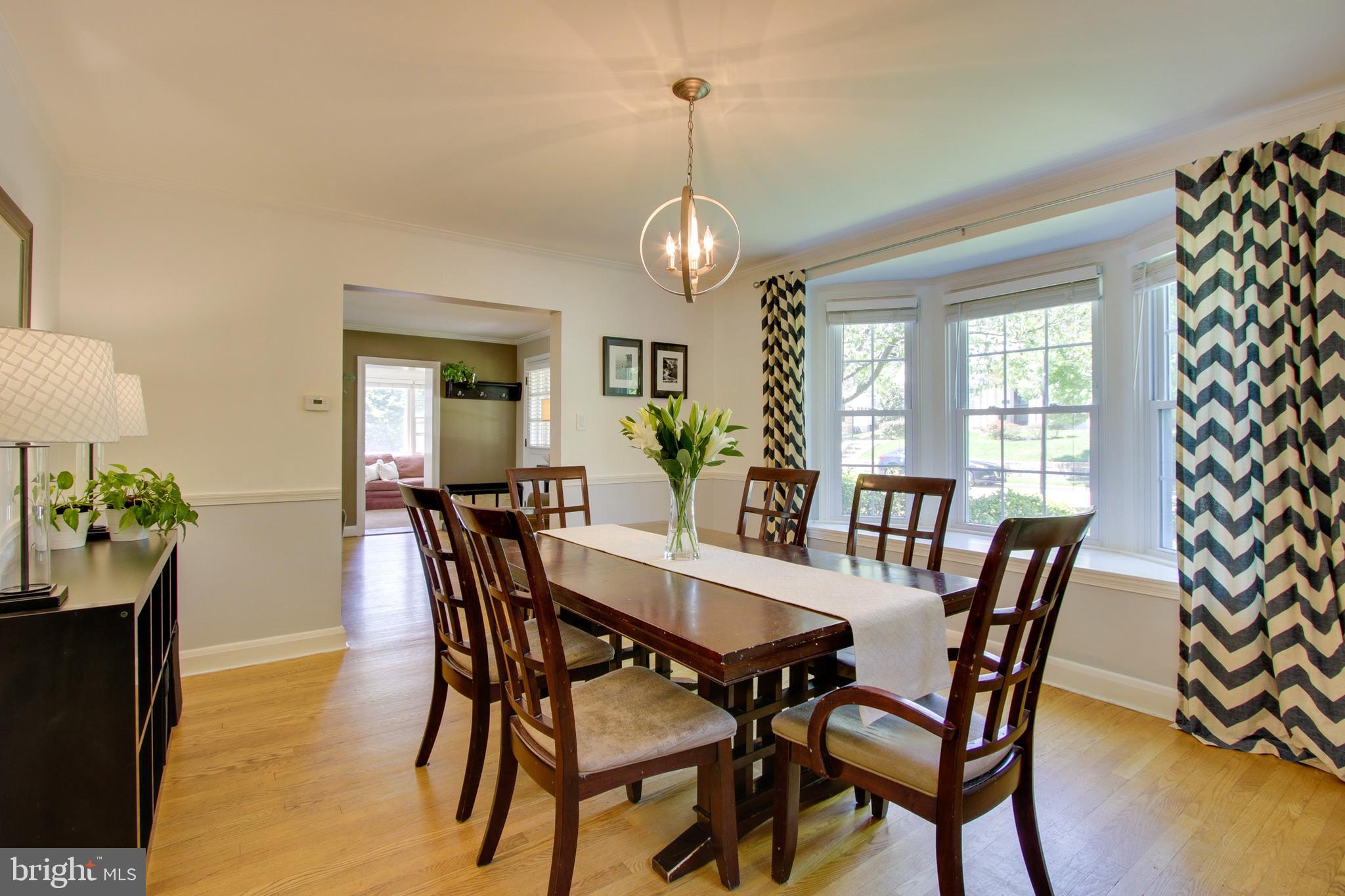 607 Worcester Road Baltimore, MD 21286 - Photo 15 of 42 a view of a dining room with furniture window and wooden floor