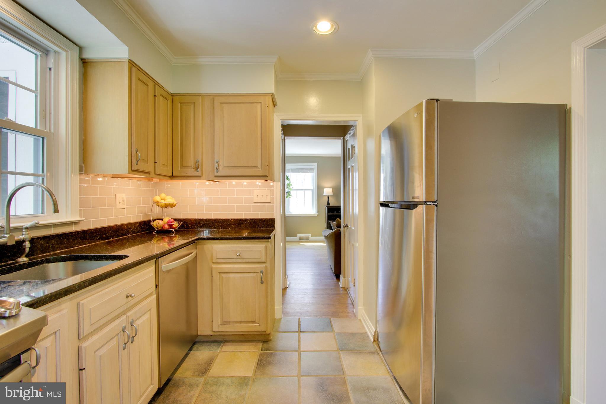 607 Worcester Road Baltimore, MD 21286 - Photo 17 of 42 a kitchen with a refrigerator and a sink