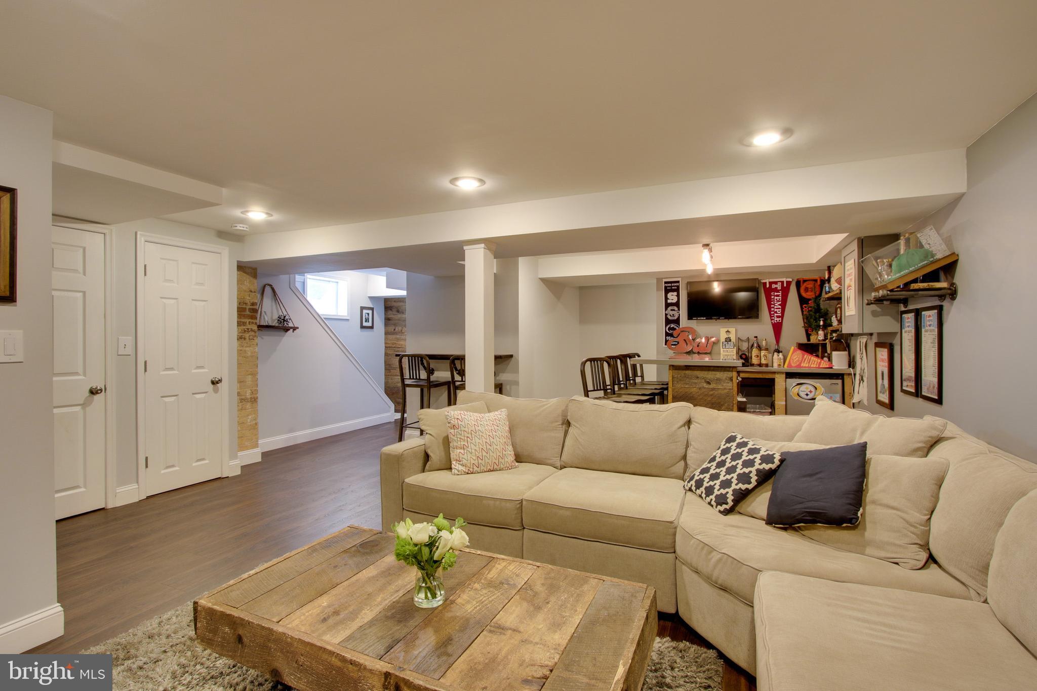 607 Worcester Road Baltimore, MD 21286 - Photo 26 of 42 a living room with furniture and a wooden floor