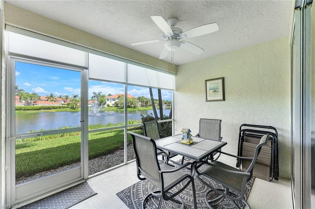 23861 Costa Del Sol Road, Unit 103 Estero, FL 34135 - Photo 14 of 29 a view of a dining room with furniture window and wooden floor