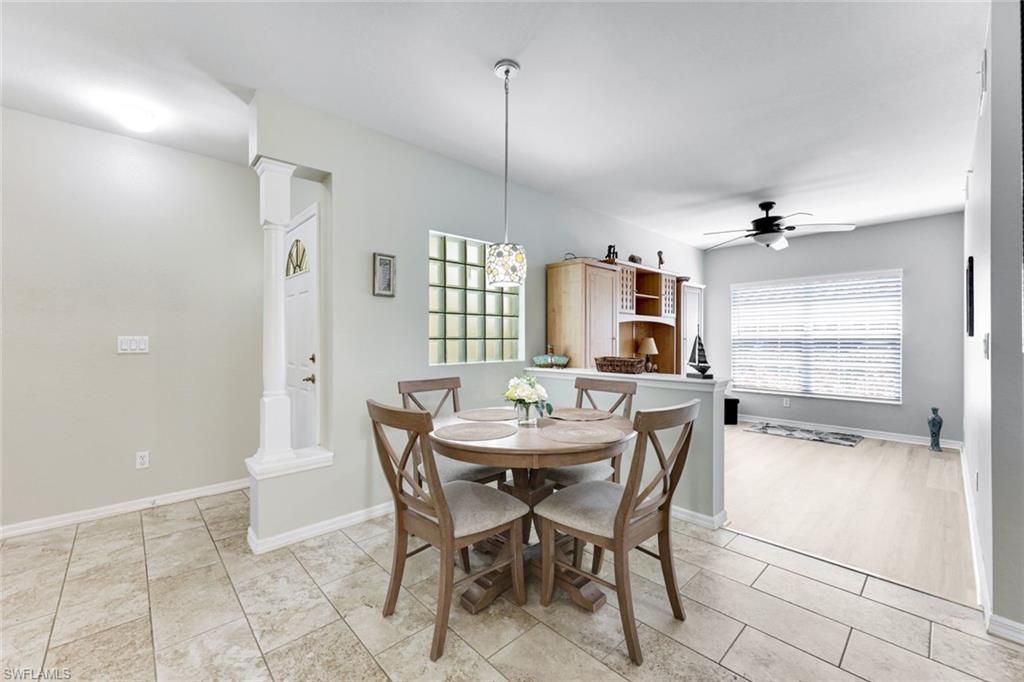 23861 Costa Del Sol Road, Unit 103 Estero, FL 34135 - Photo 6 of 29 a dining room with furniture and window
