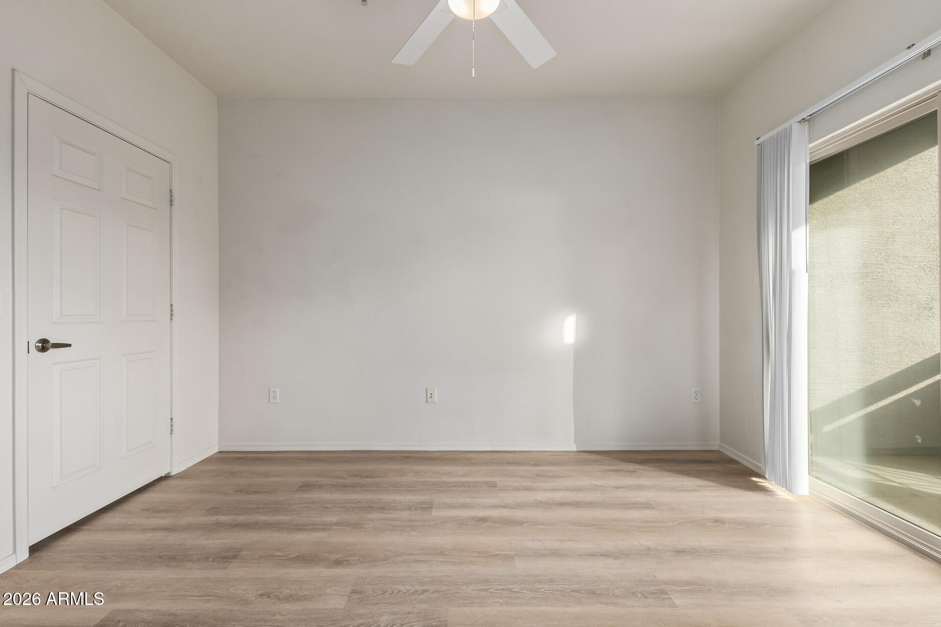 435 West Rio Salado Parkway, Unit 210 Tempe, AZ 85281 - Photo 17 of 35 a view of an empty room and window and wooden floor
