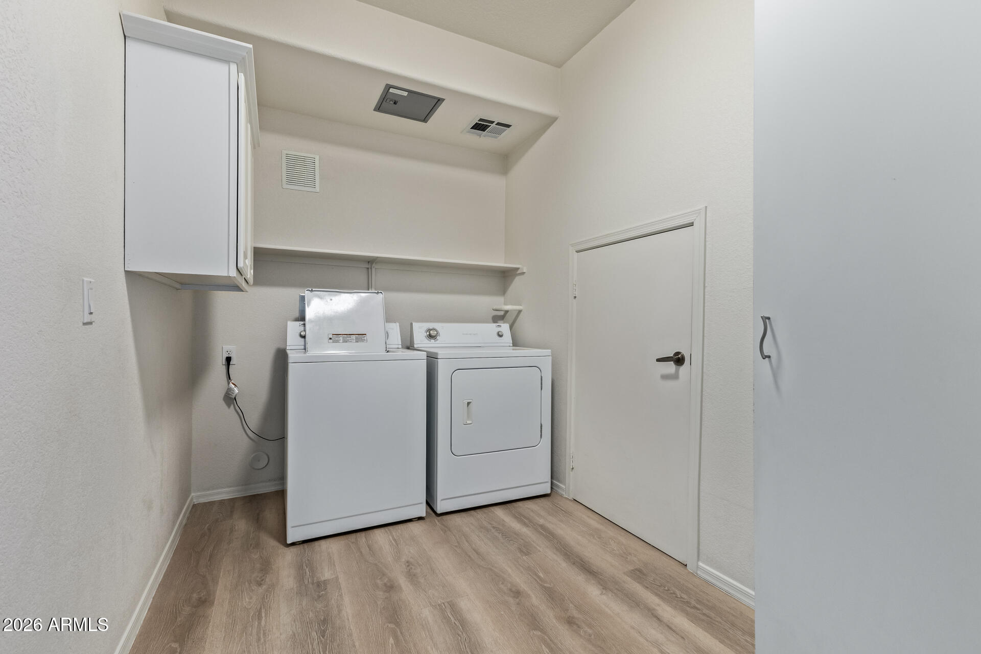 435 West Rio Salado Parkway, Unit 210 Tempe, AZ 85281 - Photo 23 of 35 a utility room with cabinets washer and dryer
