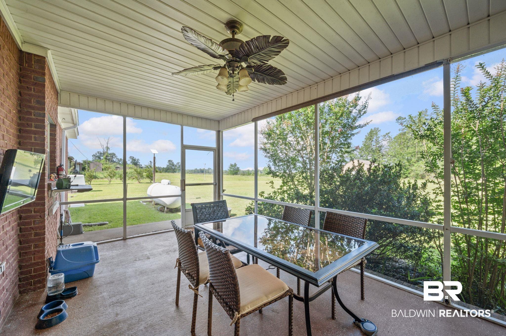 48513 Phillipsville Road Bay Minette, AL 36507 - Photo 44 of 50 Sunroom featuring a ceiling fan and outdoor dining area
