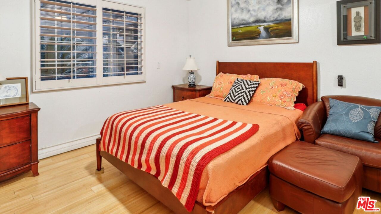 3548 Rosa Way Fallbrook, CA 92028 - Photo 27 of 49 a bedroom with a bed and wooden floor