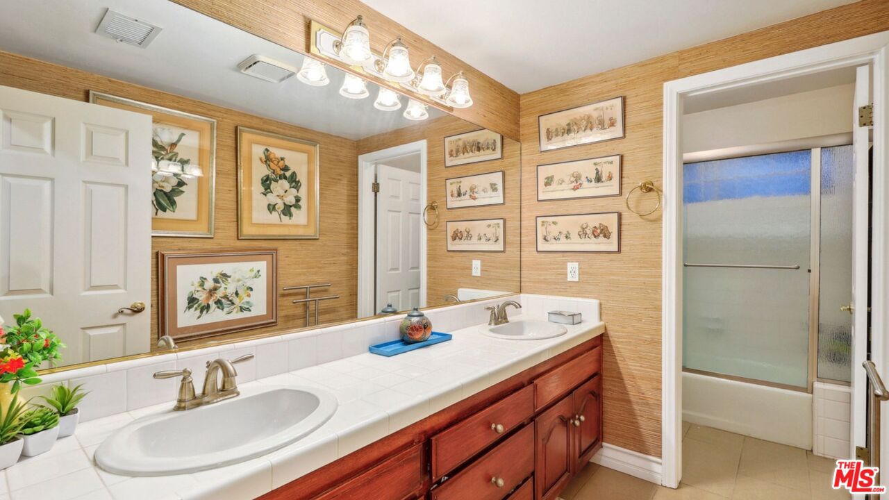 3548 Rosa Way Fallbrook, CA 92028 - Photo 28 of 49 a bathroom with a sink double vanity and a shower
