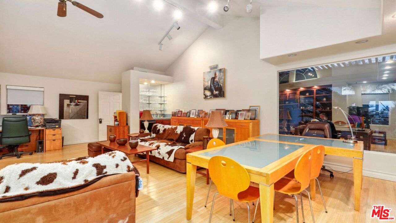 3548 Rosa Way Fallbrook, CA 92028 - Photo 32 of 49 a living room with furniture kitchen view and a flat screen tv