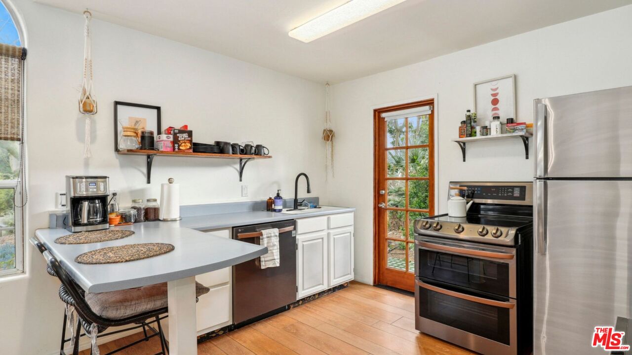 3548 Rosa Way Fallbrook, CA 92028 - Photo 35 of 49 a kitchen with a stove a sink dishwasher and a refrigerator