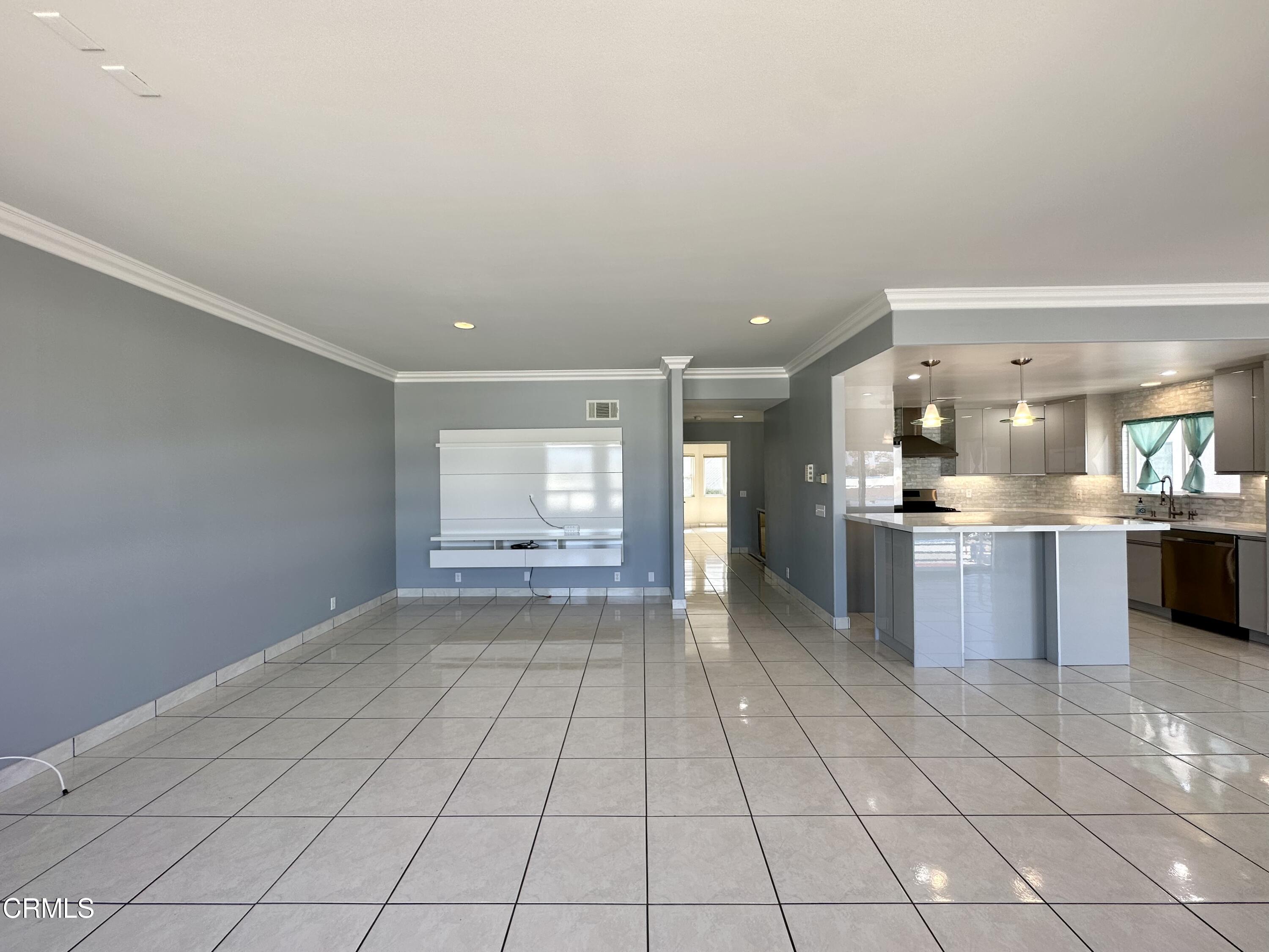 4053 Sunset Lane Oxnard, CA 93035 - Photo 8 of 33 a open kitchen with a sink and cabinets