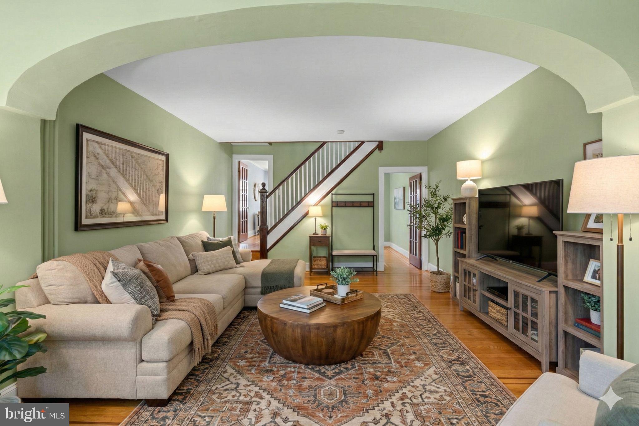 a living room with furniture and a flat screen tv