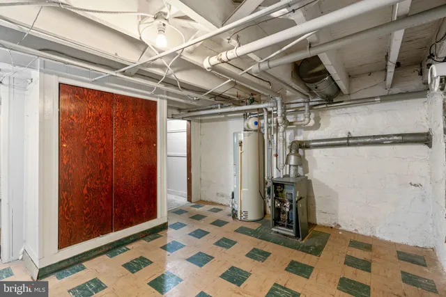 a view of storage and utility room with racks on the wall