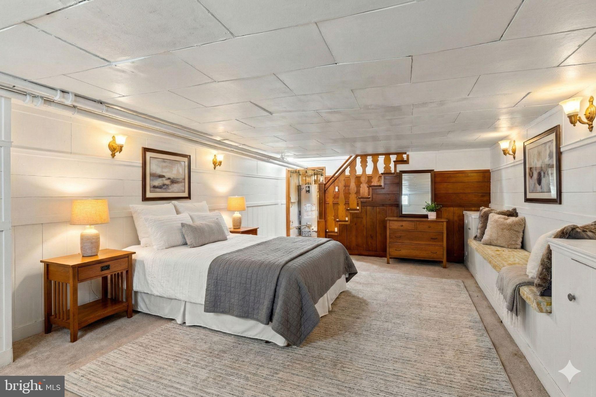 310 Drew Street Baltimore, MD 21224 - Photo 30 of 47 a bedroom with a large bed and a couch