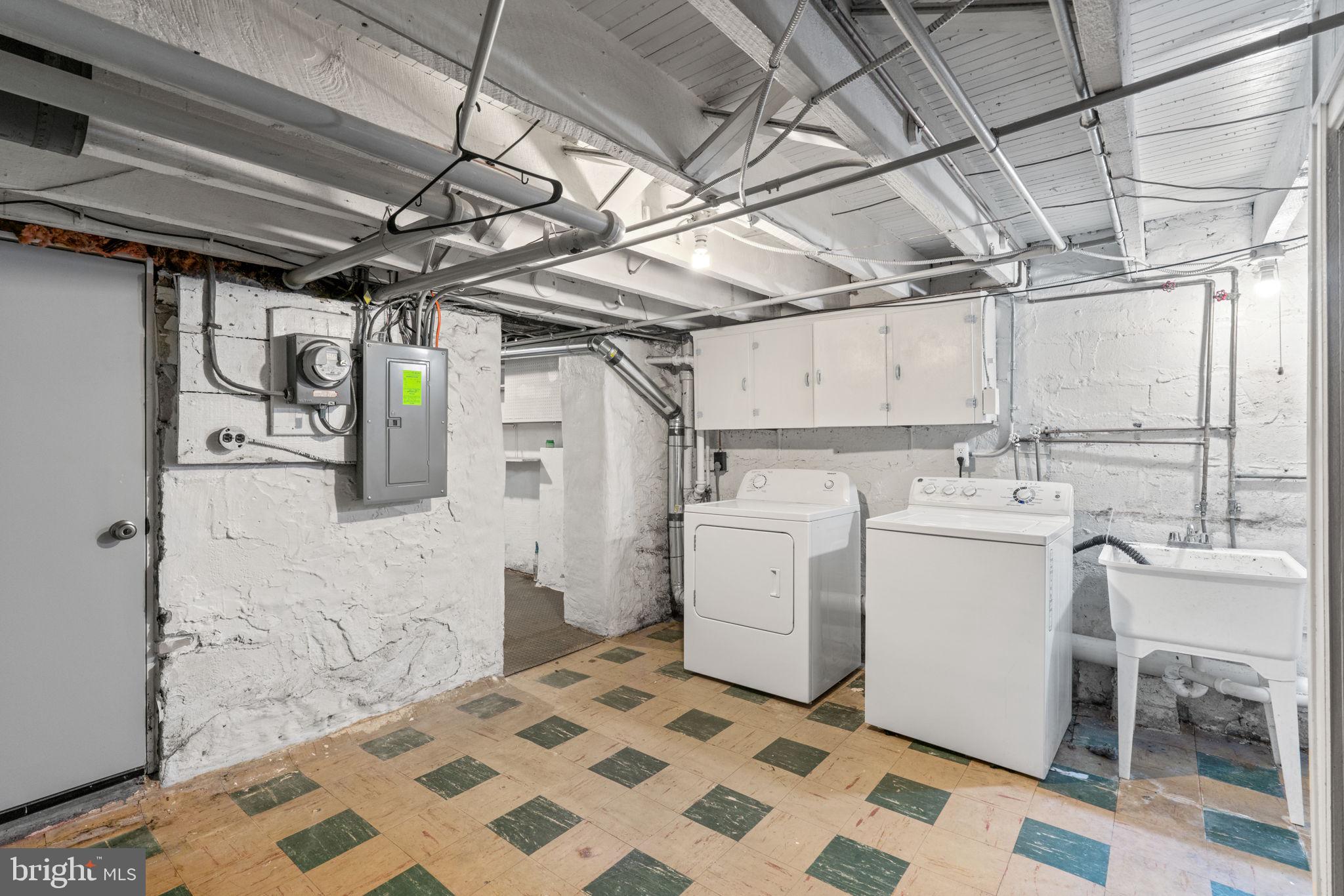 310 Drew Street Baltimore, MD 21224 - Photo 32 of 47 a utility room with dryer and washer