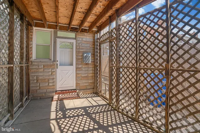 a view of a car park in front of house