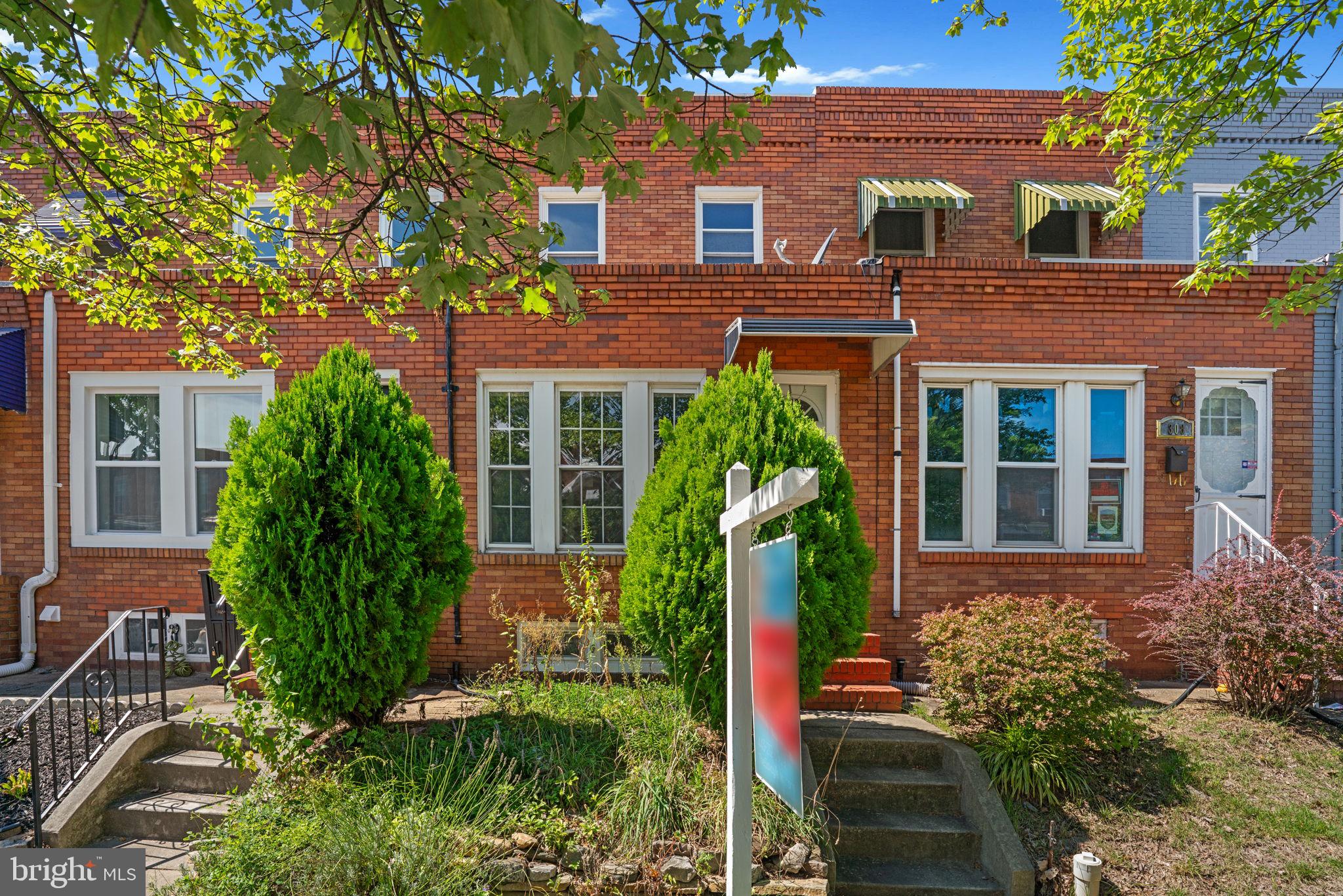 310 Drew Street Baltimore, MD 21224 - Photo 45 of 47 front view of a house with a yard