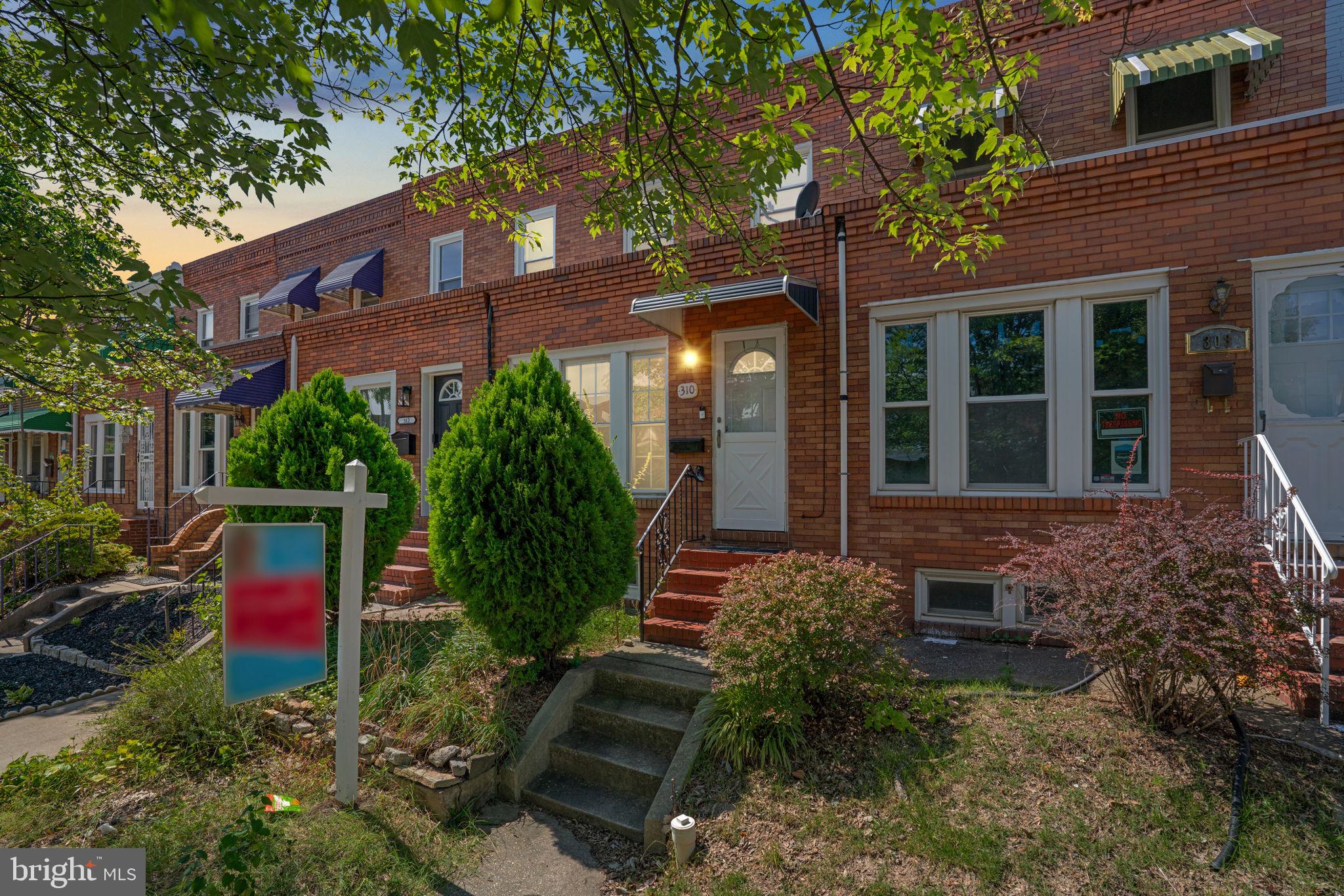 310 Drew Street Baltimore, MD 21224 - Photo 47 of 47 a view of house with a yard and potted plants