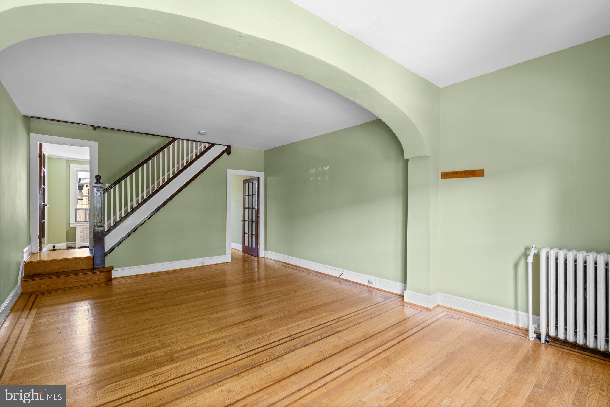 310 Drew Street Baltimore, MD 21224 - Photo 6 of 47 a view of empty room with wooden floor