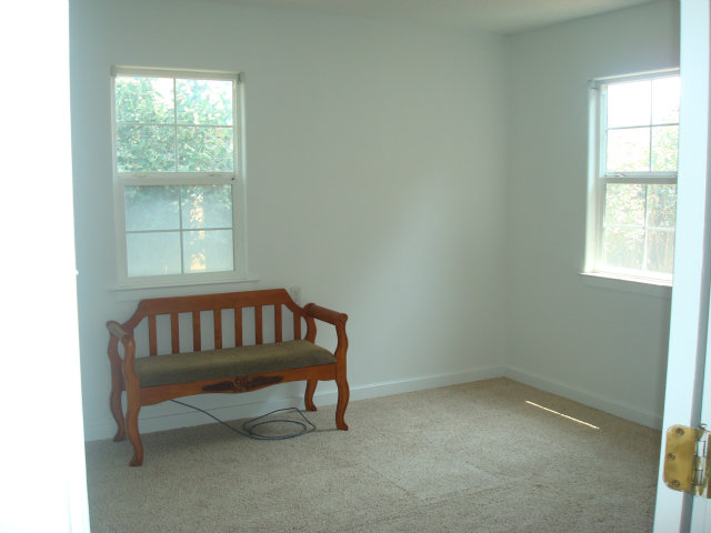3401 Roland Drive Santa Cruz, CA 95062 - Photo 13 of 20 a bedroom with a window and a chair