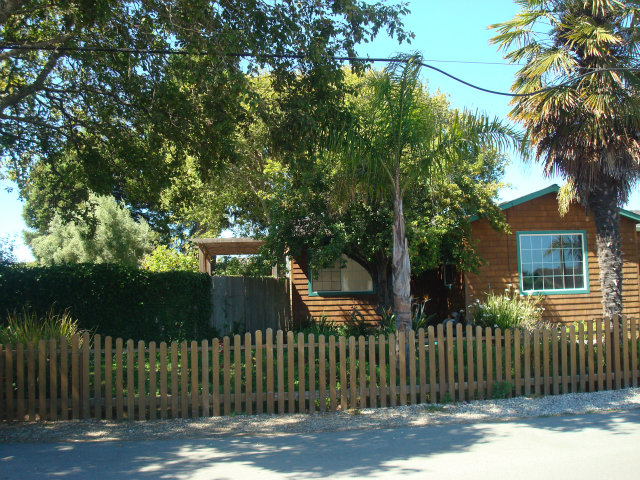3401 Roland Drive Santa Cruz, CA 95062 - Photo 2 of 20 a front view of a house with a garden