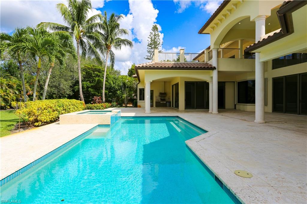823 Cassena Road Naples, FL 34108 - Photo 10 of 50 a view of an house with swimming pool and porch