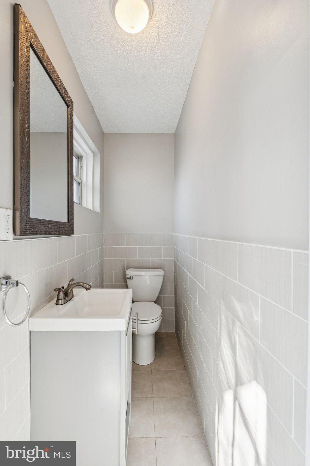 2803 Keating Street Temple Hills, MD 20748 - Photo 8 of 20 a bathroom with a sink and toilet