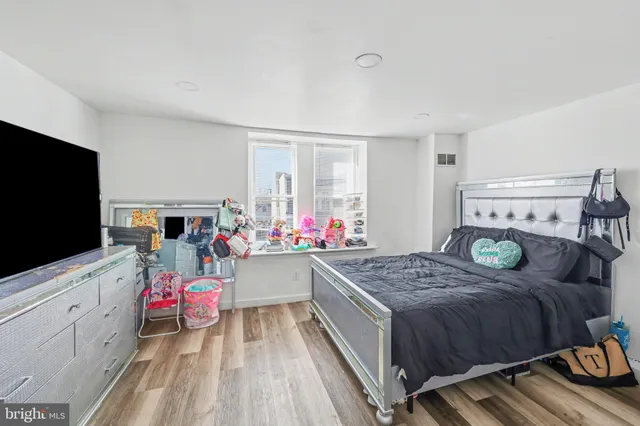 a bathroom with a granite countertop sink and a stove