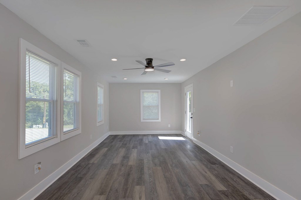 326 Mobley Street Hamilton, GA 31811 - Photo 12 of 23 a view of an empty room with wooden floor and a window