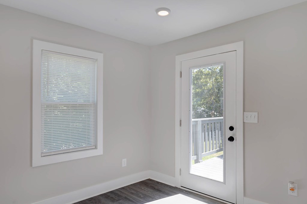 326 Mobley Street Hamilton, GA 31811 - Photo 14 of 23 an empty room with wooden floor and a window