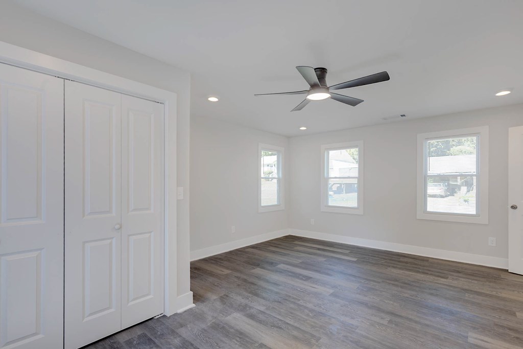 326 Mobley Street Hamilton, GA 31811 - Photo 18 of 23 a view of an empty room with a window and wooden floor