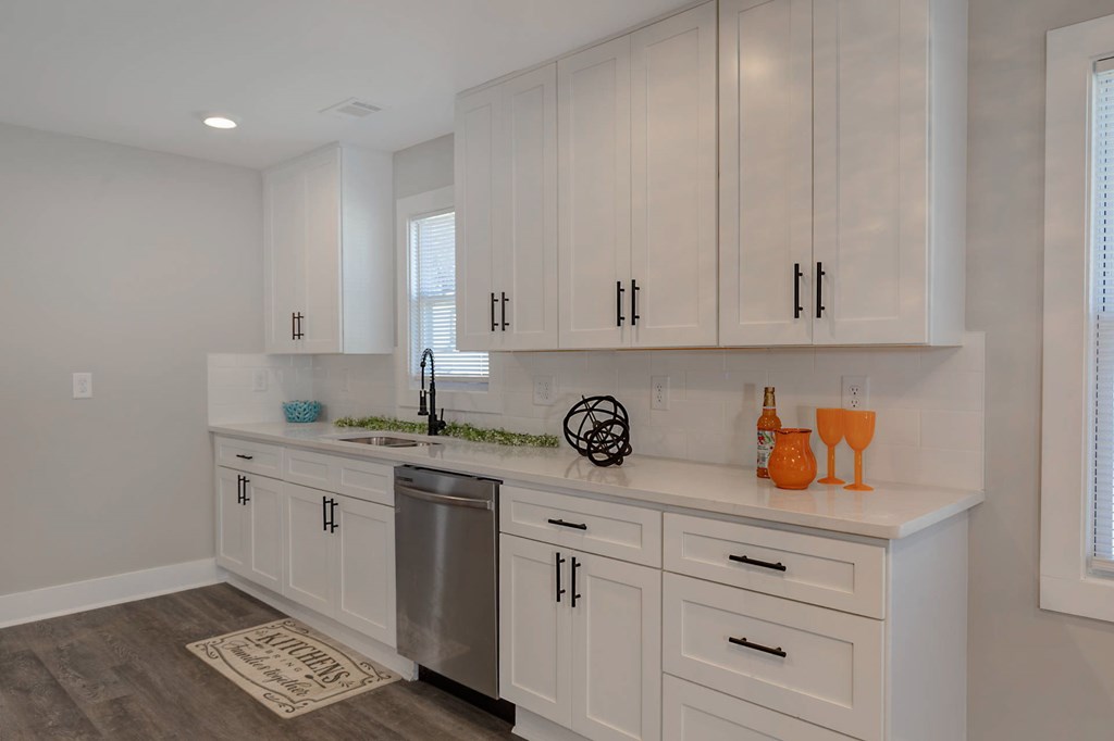 326 Mobley Street Hamilton, GA 31811 - Photo 8 of 23 a kitchen with white cabinets and sink