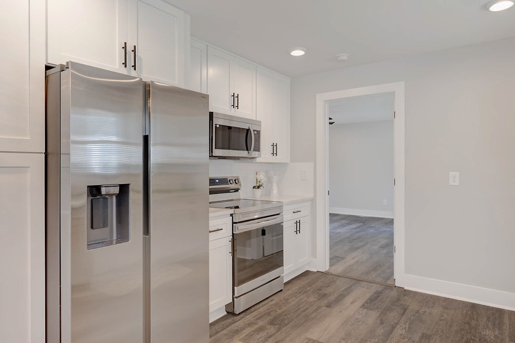 326 Mobley Street Hamilton, GA 31811 - Photo 9 of 23 a kitchen with stainless steel appliances a refrigerator sink and microwave