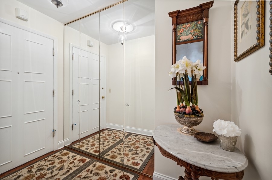 715 Ridge Road, Unit 3C Wilmette, IL 60091 - Photo 4 of 24 a view of a dining room with furniture and chandelier