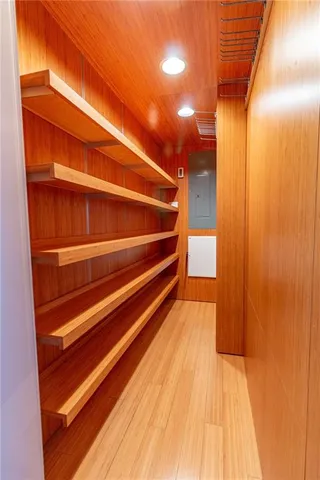 a living room with furniture a fireplace and wooden floor