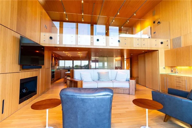 a living room with furniture a rug and a painting