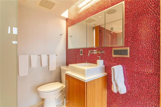 a spacious bathroom with a tub and sink