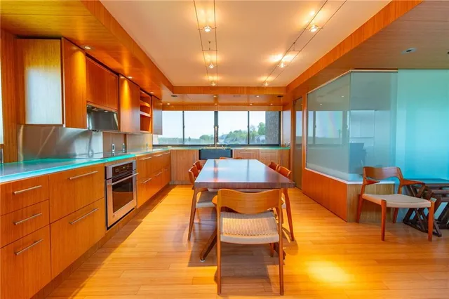 a kitchen with stainless steel appliances granite countertop a sink and a counter