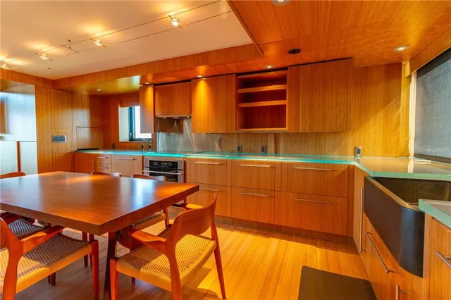 a kitchen with a sink and a large window